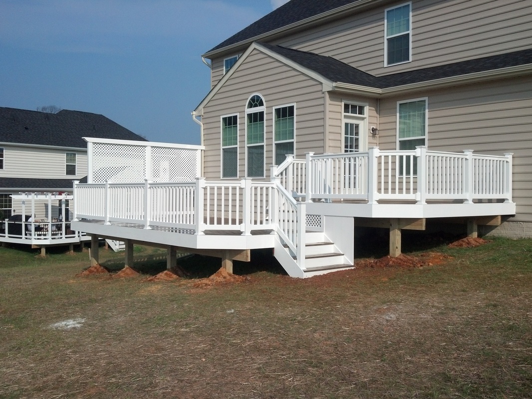 Harford County Maryland Multi-Level Maintenance Free Evergrain Deck with White Vinyl Railings and Lattice Privacy Screen.