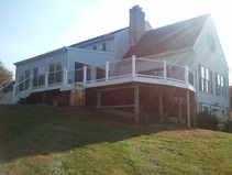 Baltimore MD Deck Replacement featuring PVC Railings with Deckorator Balusters.